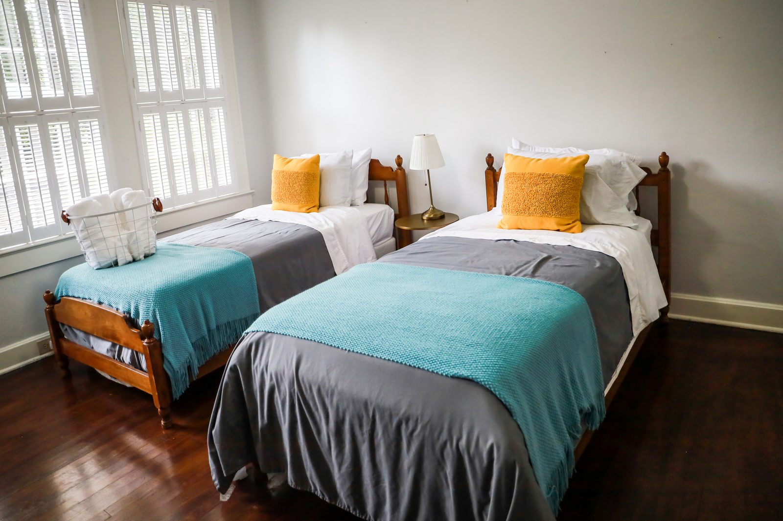 A furnished shared bedroom with two twin beds in a Texas master-leased home