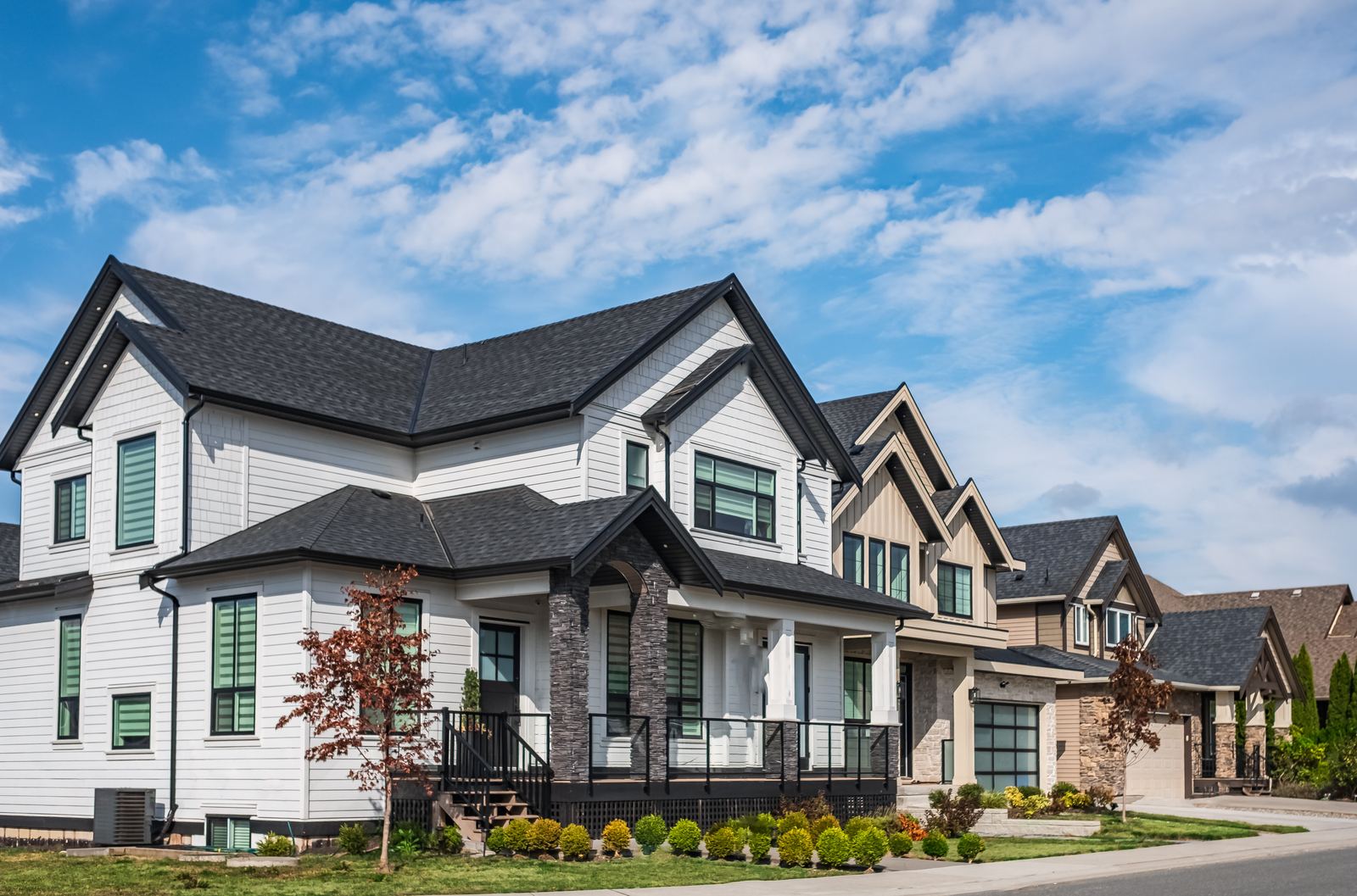 A modest single-family home with a well-kept front yard