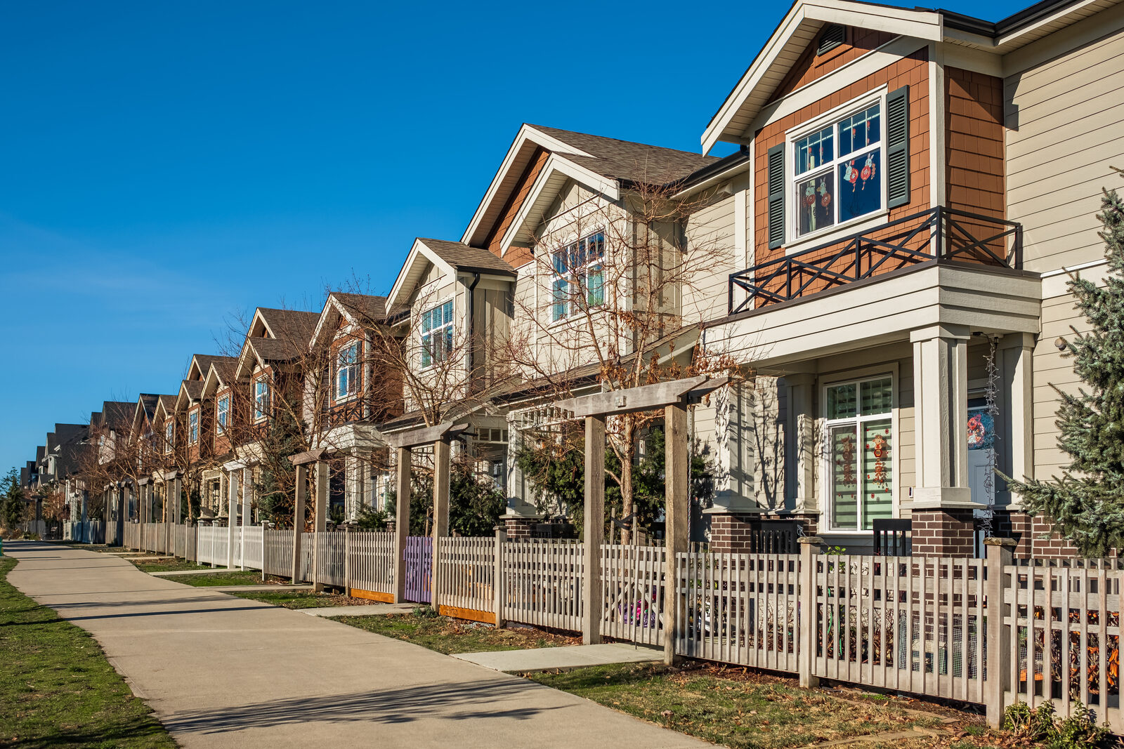 A quiet residential street with sidewalks in a Texas neighborhood